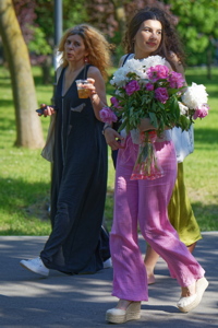 Couple of womens strolling outdoors on a sunny day